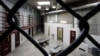  FILE - The interior of an unoccupied communal cellblock is seen at Camp VI, a prison used to house detainees at the U.S. Naval Base at Guantanamo Bay, March 5, 2013.