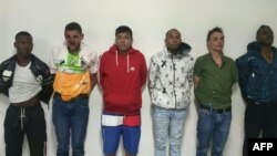 A handout picture released on August 10, 2023, by the Ecuadorian Police shows six Colombian men arrested in connection with the assassination of presidential candidate Fernando Villavicencio in Quito.