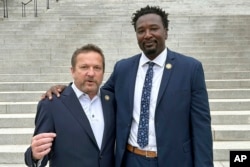 South Carolina state Representatives Brandon Cox, left, and Jermaine Johnson talk about their efforts to honor Robert Smalls, who will soon be the first African American individual with a statue at the South Carolina Statehouse, on Sept. 13, 2024, in Columbia.