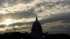 The Sun rises over the U.S. Capitol, Washington (undated file photo).