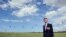 British World War II veteran Frederick Glover looks at soldiers parachuting down during a D-Day commemoration paratroopers launch event in Ranville, northern France, on the eve of the 70th anniversary of the World War II Allied landings in Normandy.