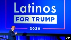 FILE - President Donald Trump give a thumbs up to the cheering crowd after a Latinos for Trump Coalition roundtable in Phoenix, Arizona, Sept. 14, 2020.