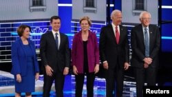 Democratic U.S. presidential candidates Senator Amy Klobuchar, South Bend Mayor Pete Buttigieg, Senator Elizabeth Warren, former Vice President Joe Biden and Senator Bernie Sanders pose at the start of their fifth 2019 Democratics debate.