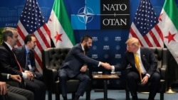 U.S. President Donald Trump shakes hands with Syrian President Ahmed al-Sharaa. July 8, 2026.