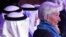 IMF chief Christine Lagarde, right, attends an international conference on Islamic finance, in Kuwait City, Nov. 11, 2015. She has urged Gulf countries, hurt by falling oil prices, to consider scaling back subsidies and levying taxes. 