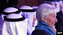 The head of the International Monetary Fund, Christine Lagarde, right, attends an international conference on Islamic finance, in Kuwait City, Nov. 11, 2015.