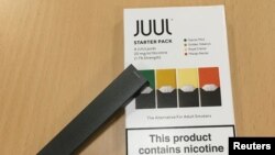 FILE - A Juul e-cigarette starter pack is seen July 16, 2018.