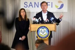 Connecticut Gov. Ned Lamont, right, speaks to the media as Lt. Gov. Susan Bysiewicz, left, looks on March 12, 2020, in Meriden, Conn.