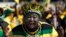 A woman sporting headgear with portraits of South African president Jacob Zuma attends a final African National Congress (ANC) election rally in Soweto, on the edge of Johannesburg.