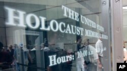 FILE - People line to enter the U.S. Holocaust Memorial Museum in Washington.