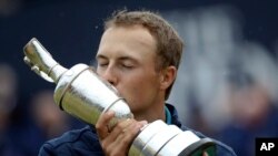 Jordan Spieth of the United States kisses the trophy after winning the British Open Golf Championships at Royal Birkdale, Southport, England, Sunday July 23, 2017.