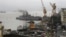 Ships ride at anchors at a naval dockyard where a submarine caught fire and sank after an explosion early Wednesday in Mumbai, August 14, 2013. 