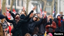 Protesters gesture during a demonstration by trade unions and workers, at a national strike demanding stronger public services in Brussels, Belgium, Feb. 13, 2025. 