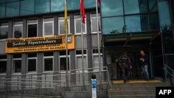 Turkish police officers enter Istanbul's Municipal Theatre building after Turkish authorities banned a Kurdish-language play, in Gaziosmanpasa district, Istanbul, Turkey, Oct. 13, 2020. 