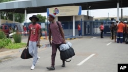 FILE - Students leave the campus at the North-West University in Mahikeng, South Africa, (also known as Mafikeng) Feb. 25, 2016. 