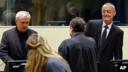 Jovica Stanisic, left, and Franko Simatovic, right, appear in court for their retrial at the United Nations Mechanism for International Criminal Tribunals in The Hague, Netherlands, June 13, 2017.