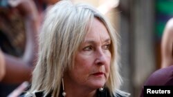 June Steenkamp, mother of Reeva Steenkamp, arrives at the North Gauteng High Court in Pretoria for the second day of sentencing procedures for Oscar Pistorius, October 14, 2014. 