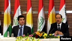 PM Irak Nuri al-Maliki (kanan) bertemu PM Kurdistan Nechirvan Barzani di Irbil, ibukota wilayah Kurdistan (9/6). 