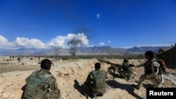 FILE- Afghan security forces take position during a gun battle between Taliban and Afghan security forces in Laghman province, Afghanistan, March 1, 2017. REUTERS/Parwiz