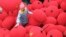 A worker walks among newly-made red lanterns ahead of the Spring Festival at a family workshop in Wenxian county, Henan province, China.