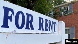 FILE - A for-rent sign sits in front of a home in Arlington, Va., June 8, 2021.