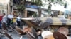 Iranian soldiers destroying satellite dishes with an army tank in the southwestern city of Shiraz. Iranian authorities carry out regular crackdowns to remove satellites from rooftops, and issue warnings against their use, September 28, 2013.