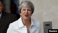 Britain's Prime Minister, Theresa May, leaves the BBC after appearing on the Andrew Marr Show, in central London, July 15, 2018.