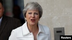 British Prime Minister Theresa May leaves the BBC after appearing on the Andrew Marr Show, in central London, July 15, 2018.