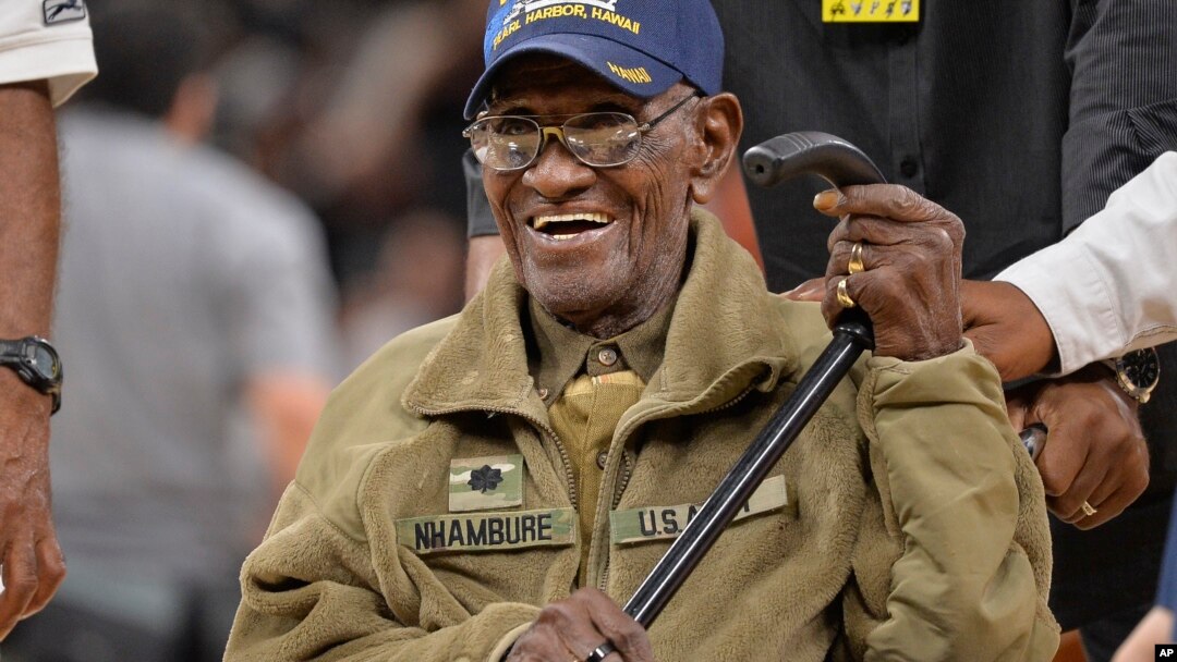 FILE - Richard Overton leaves the court after a special presentation honoring him as the oldest living American war veteran, March 23, 2017, at an NBA basketball game. 