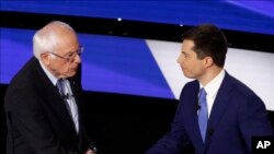FILE - Democratic presidential candidates Sen. Bernie Sanders, I-Vt., left and former South Bend Mayor Pete Buttigieg shake hands, Jan. 14, 2020, after a Democratic presidential primary debate hosted by CNN and the Des Moines Register in Des Moines, Iowa.