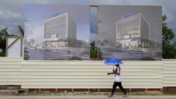 A man walks past a development site for a Chinese Investment bank in Nuku'alofa, Tonga, April 10, 2019.