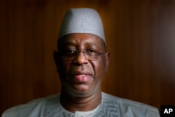 FILE—Senegal President Macky Sall poses during an interview with The Associated Press at the presidential palace in Dakar, Senegal, February 9, 2024.