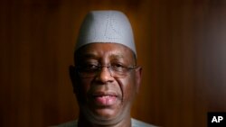 FILE — Senegal President Macky Sall poses during an interview with The Associated Press at the presidential palace in Dakar, Senegal, on February 9, 2024. 