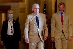 FILE - Senate Minority Leader Mitch McConnell of Kentucky walks toward the Senate chamber in Washington, Aug. 9, 2021.
