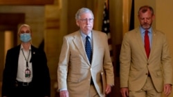 FILE - Senate Minority Leader Mitch McConnell of Kentucky walks toward the Senate chamber in Washington, Aug. 9, 2021.