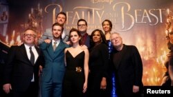 Director Bill Condon and composer Alan Menken pose with cast members Dan Stevens, Luke Evans, Emma Watson, Josh Gad, Audra McDonald and Gugu Mbatha-Raw at the premiere of "Beauty and the Beast" in Los Angeles, March 2, 2017. 