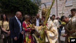 FILE — Palestinian Christians attend Palm Sunday mass in a Greek Orthodox church in Gaza City, Sunday, April 9, 2023.