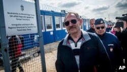 Hungarian Interior Minister Sandor Pinter, foreground, inspects the enlarged transit zone set up for migrants at the country's southern border with Serbia near Tompa, 169 kms southeast of Budapest, April 6, 2017. 