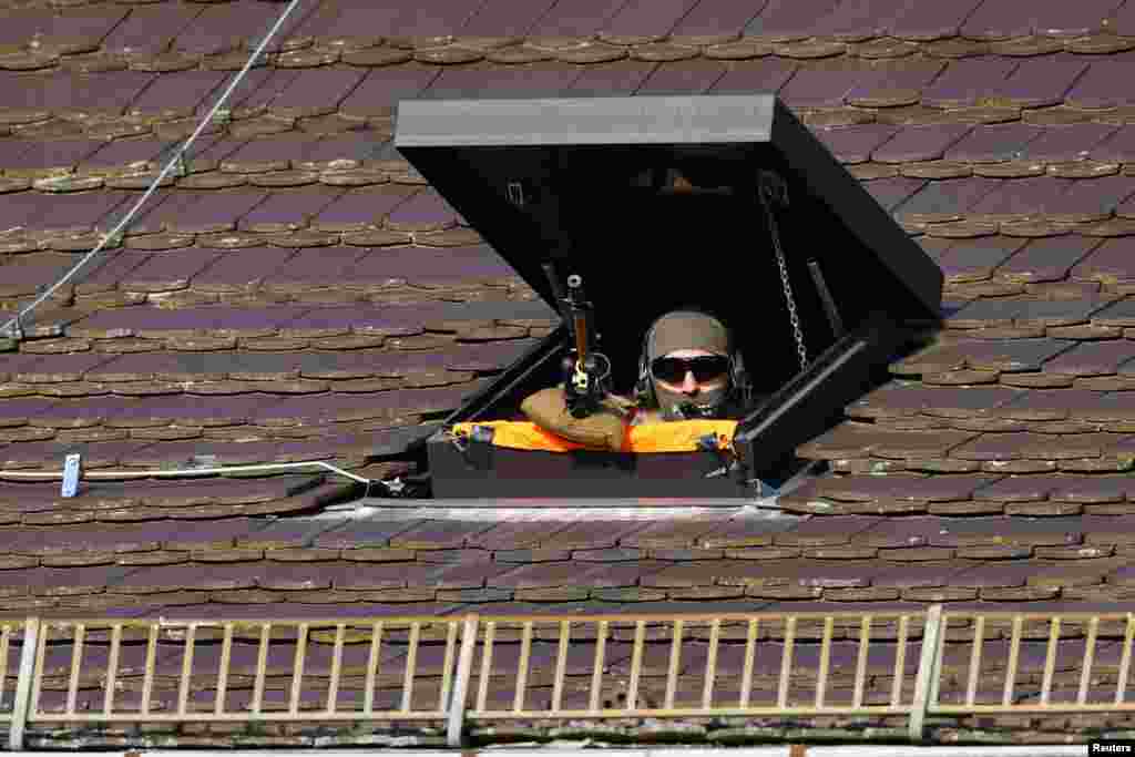 A sniper of the German police takes position on the day German President Frank-Walter Steinmeier welcomes U.S. President Joe Biden at Bellevue Palace in Berlin, Germany.