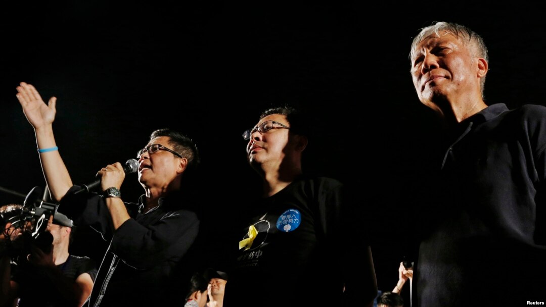 Para pendiri gerakan permbangkangan sipil Occupy Central, dari kiri ke kanan, Chan Kin-man, Benny Tai dan Chu Yiu-ming, meluncurkan gerakan tersebut, Agustus 2014.