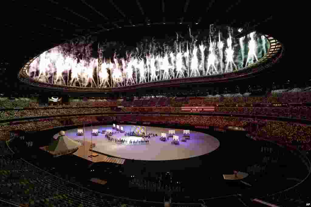 Fireworks explode during the opening ceremony in the Olympic Stadium at the 2020 Summer Olympics, Friday, July 23, 2021, in Tokyo, Japan. (AP Photo/Patrick Semansky)