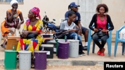 Polling officials wait at the local IEC (Independent Electoral Commission) headquarters to distribute the ballot boxes to the polling stations, in Serekunda, Gambia, Nov. 29, 2016.