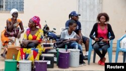 Polling officials wait at the local IEC (Independent Electoral Commission) headquarters to distribute the ballot boxes to the polling stations, in Serekunda, Gambia, Nov. 29, 2016. Commission Chairman Alieu Momar Njai fled to Senegal after he received word that Gambian authorities were plotting against him.