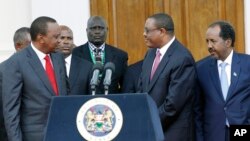 FILE - Kenya's President Uhuru Kenyatta, left, Ethiopian Prime Minister, Hailemariam Desalegn, middle right, and Somalian President, Hassan Sheikh Mohamud, right, after the meeting of the Intergovernmental Authority on Development (IGAD) consultative meeting on the situation on South Sudan, held at State House, Nairobi, Kenya.