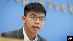 FILE - In this Sept. 11, 2019, file photo, Hong Kong activist Joshua Wong addresses the media during a press conference in Berlin, Germany. 