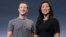 FILE - Facebook CEO Mark Zuckerberg and his wife, Priscilla Chan, smile as they prepare for a speech in San Francisco. 