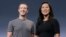 FILE - Facebook CEO Mark Zuckerberg and his wife, Priscilla Chan, smile as they prepare for a speech in San Francisco. 