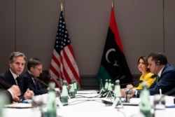 U.S. Secretary of State Antony Blinken, left, speaks as he meets with Libyan Prime Minister Abdulhamid Dabaiba, right, at the Berlin Marriott Hotel in Berlin, Germany, June 24, 2021.