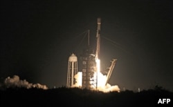 Intuitive Machines' Athena lander, atop a SpaceX rocket, lifts off from NASA's Kennedy Space Center in Florida on Feb. 26, 2025. Athena is expected to land on the moon on March 6, 2025.