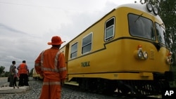 A train prepares to start during the official recommencement of commercial train services on a rehabilitated rail corridor in Phnom Penh October 22, 2010.